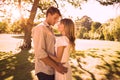 Smiling couple standing and embracing in park Royalty Free Stock Photo