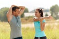 Smiling couple stretching outdoors Royalty Free Stock Photo