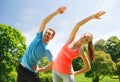 Smiling couple stretching outdoors Royalty Free Stock Photo