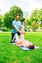 Smiling couple stretching outdoors Royalty Free Stock Photo