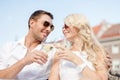 Smiling couple in sunglasses drinking wine in cafe Royalty Free Stock Photo