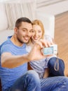 Smiling couple taking picture with digital camera Royalty Free Stock Photo