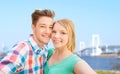 Smiling couple taking selfie over bridge Royalty Free Stock Photo