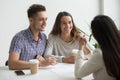 Smiling couple talking to real estate agent Royalty Free Stock Photo