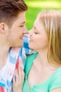 Smiling couple touching noses in park Royalty Free Stock Photo