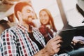 Smiling Couple Using Digital Tablet in Tour Bus Royalty Free Stock Photo