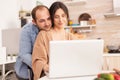 Smiling couple using laptop Royalty Free Stock Photo