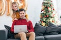 smiling couple using laptop together at home Royalty Free Stock Photo