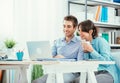 Smiling couple using a laptop Royalty Free Stock Photo