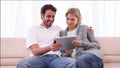 Smiling couple using a tablet computer