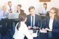 Smiling coworkers with laptops having a productive day Royalty Free Stock Photo