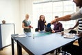 Smiling coworkers playing table tennis during a break from work Royalty Free Stock Photo