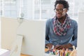 Smiling creative business employee having a videocall