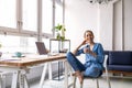 Smiling creative woman in a modern loft space