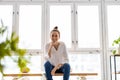 Smiling creative woman in a modern loft space