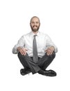 Smiling crossed legs seated businessman