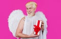 Smiling Angel with wings with present. Cupid with gift box. Valentines day.