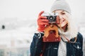 Smiling curly blond girl with retro film camera Royalty Free Stock Photo