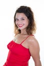 smiling curly woman portrait. girl wearing red dress in white background Royalty Free Stock Photo