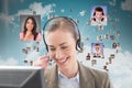 Smiling customer assitant at her desk against flying portraits of business people Royalty Free Stock Photo