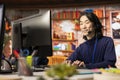 Smiling customer center worker assisting clients with installing software Royalty Free Stock Photo