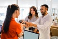 smiling customer man using EDC device while making payment at the checkout