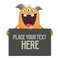 Smiling cute charming cartoon monster holding a blank sign in his hand Royalty Free Stock Photo