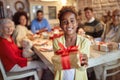 Smiling Cute girl giving x-mas present Royalty Free Stock Photo