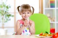 Smiling cute girl holding glass of water at home Royalty Free Stock Photo