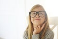 Smiling cute little girl with black eyeglasses over white background Royalty Free Stock Photo