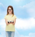 Smiling cute little girl in black eyeglasses Royalty Free Stock Photo