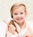 Smiling cute little girl brushing teeth Royalty Free Stock Photo