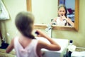 Smiling cute little girl brushing teeth in bathroom. Hygiene con Royalty Free Stock Photo