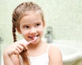 Smiling cute little girl brushing teeth Royalty Free Stock Photo