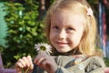 smiling cute little girl with camomile Royalty Free Stock Photo
