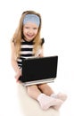 Smiling cute little girl with laptop Royalty Free Stock Photo
