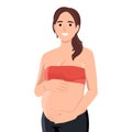 Smiling cute pregnant woman caressing her belly