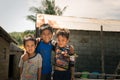 Smiling cute young boys in slum, Indonesia