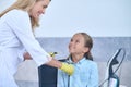 Smiling cute young patient being prepared for an audiometry test