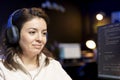 Smiling cybersecurity expert listening music pleased after finding threats