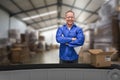 Composite 3d image of smiling warehouse manager standing with arms crossed Royalty Free Stock Photo