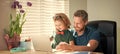 smiling dad and son in glasses use laptop at home. family blog. nerd boy do homework Royalty Free Stock Photo