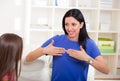 Smiling deaf girl learning sign language