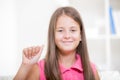Smiling deaf girl using sign language