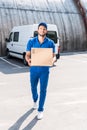 Delivery man with cardboard box Royalty Free Stock Photo