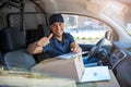 Delivery man sitting in a delivery van Royalty Free Stock Photo