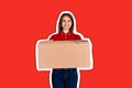 Smiling delivery person is giving a parcel to a customer Magazine collage style with trendy color background Royalty Free Stock Photo