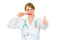 Smiling dentist female holding toothbrush