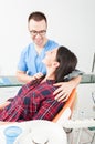 Smiling dentist holding his patient as being friendly Royalty Free Stock Photo