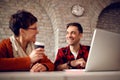 Smiling designer people working together at desk on computer Royalty Free Stock Photo